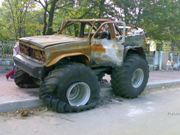 Random WTF Photo of the Week: A Burned Out Monster Truck on A Russian Sidewalk